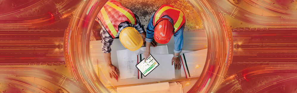 Two construction managers using COINS construction software.